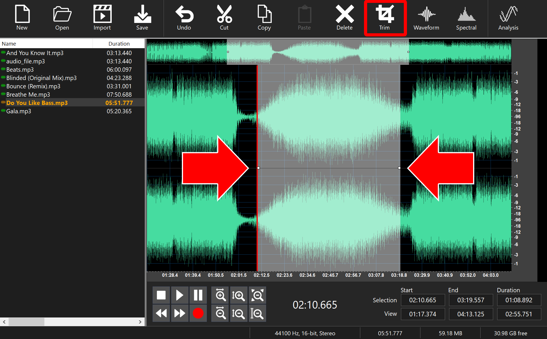 Arrows marking the start and end of a selection in the waveform, with the Trim button highlighted